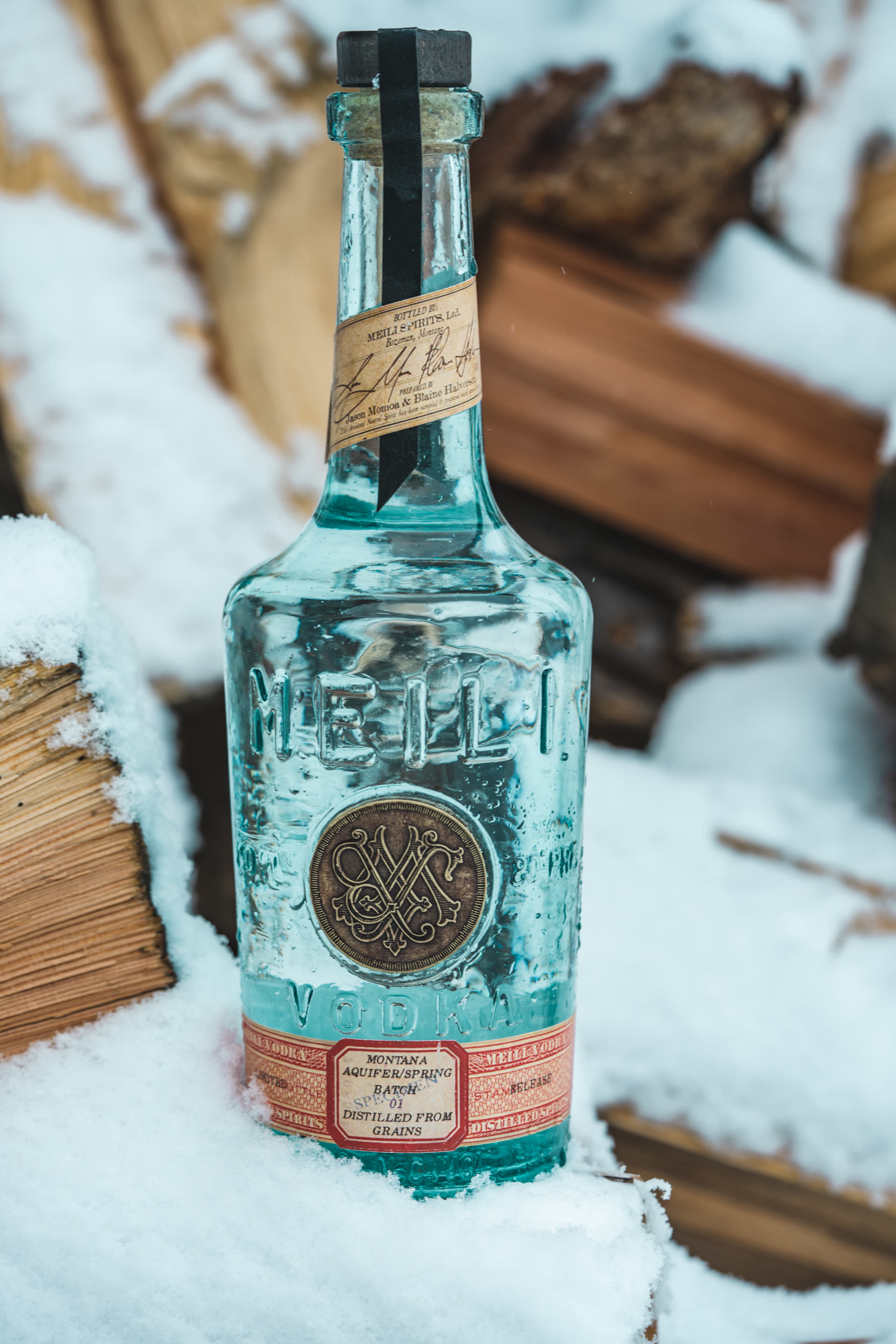 Meili bottle resting in snow