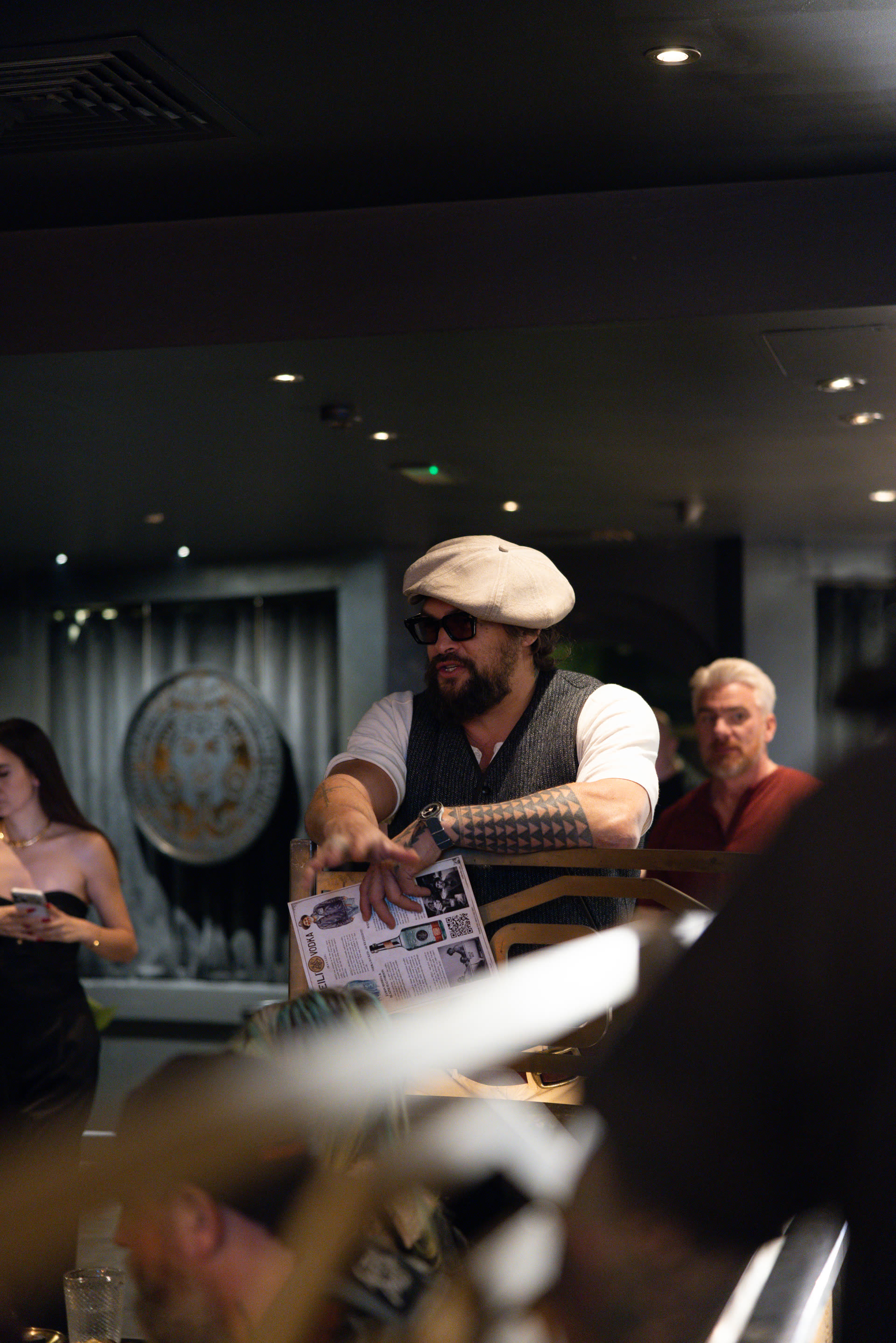 Jason Momoa celebrating Meili with the crowd